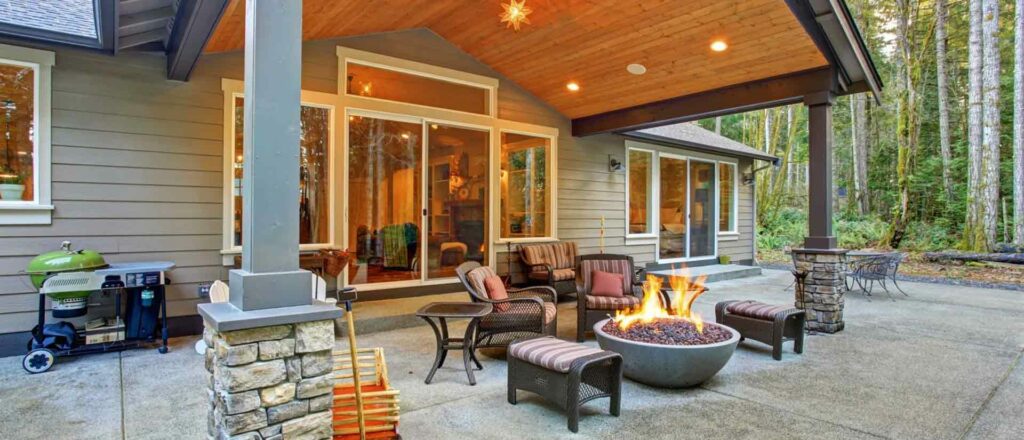 backyard patio space with chairs and firepit