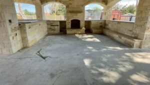 custom built outdoor kitchen and fireplace