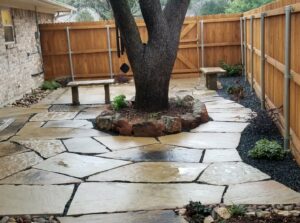 stone paver in backyard with a huge tree in the middle
