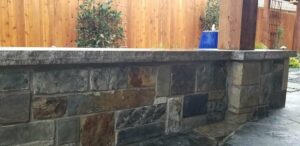 raised stone wall in backyard