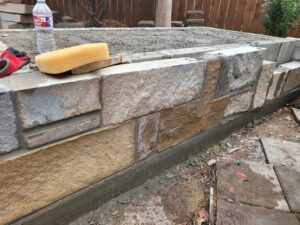 stone wall being put in