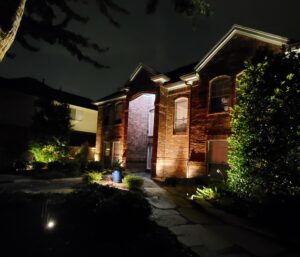 a home lit up with outdoor lights