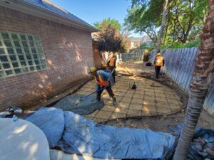concrete being poured and laid for a patio